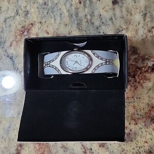 Avon silver tone cuff ladies watch